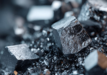 Close-up of Boron crystalline mineral blocks with a blurred background