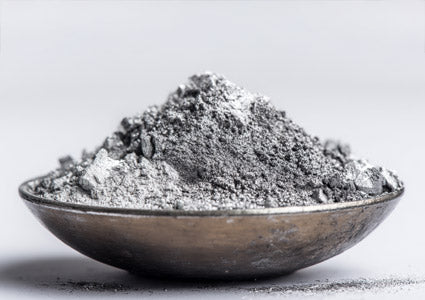 Gray Zinc powder in a bowl on a light gray background